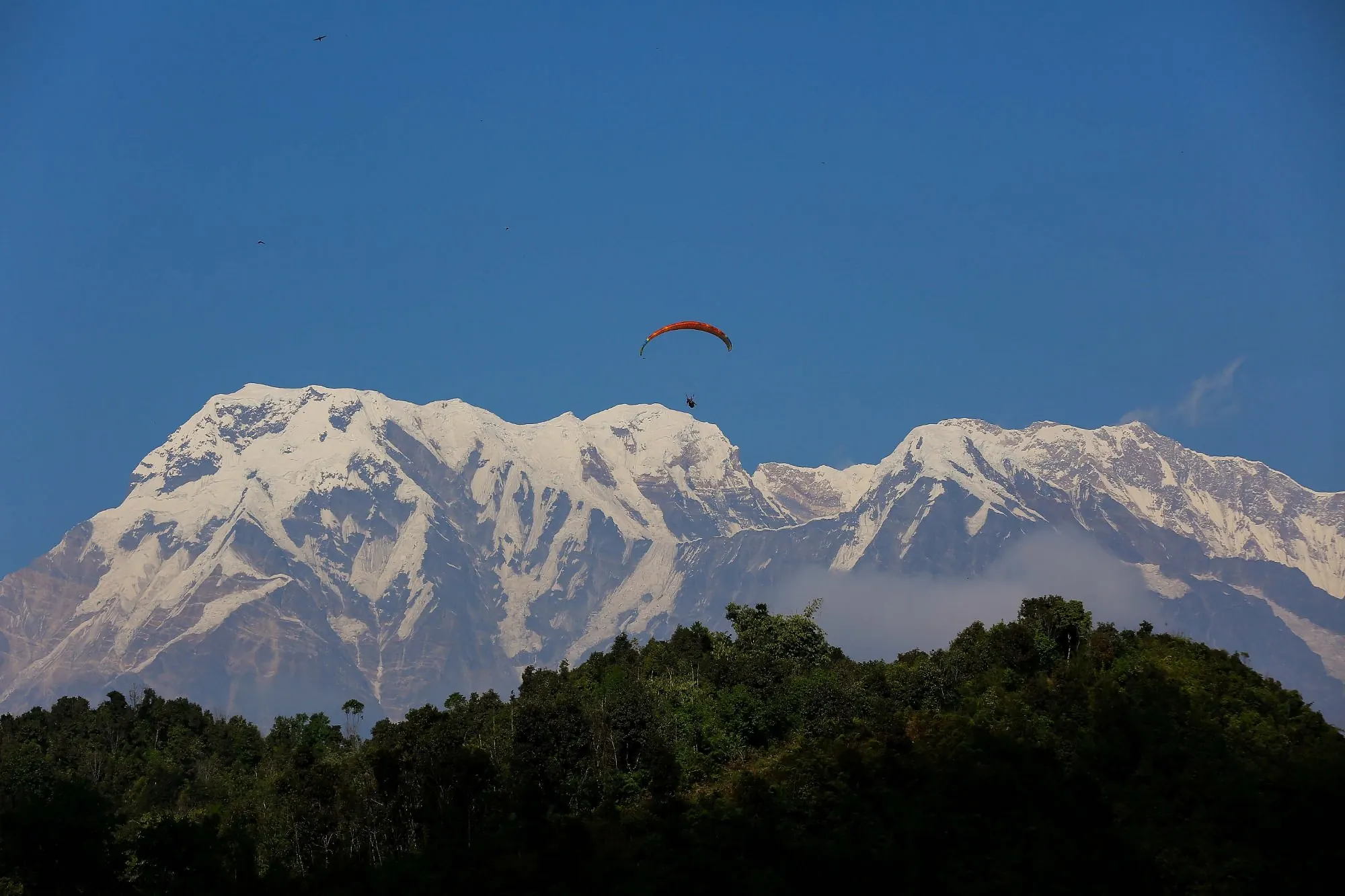 Annapurna range with a paraglider