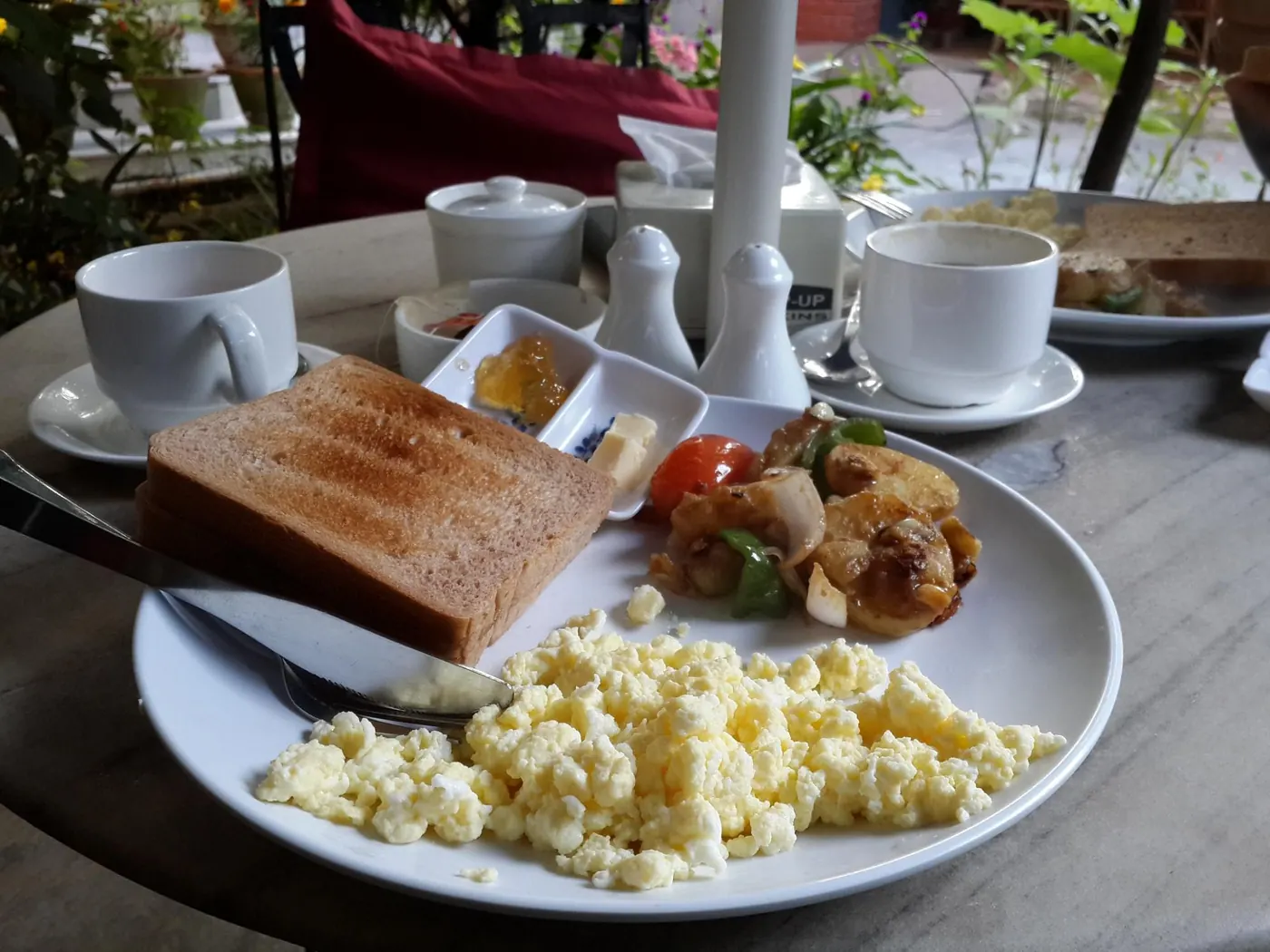 Breakfast served in the garden at The Silver Oaks Inn, Pokhara