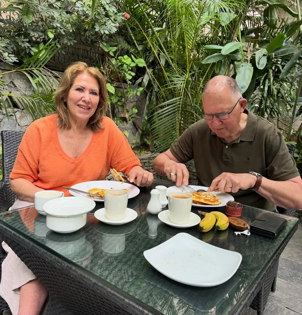 A couple having breakfast in the garden