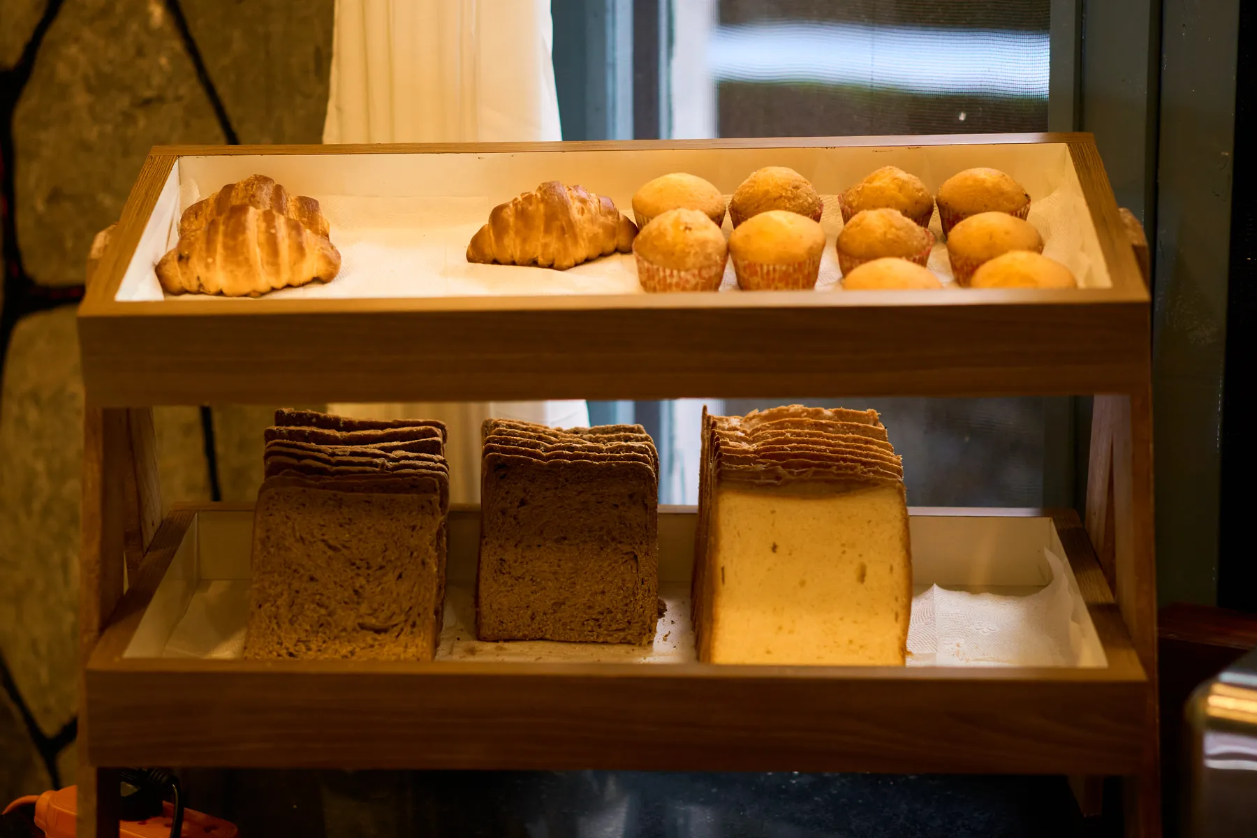Fresh croissants, buns and bread on the breakfast buffet