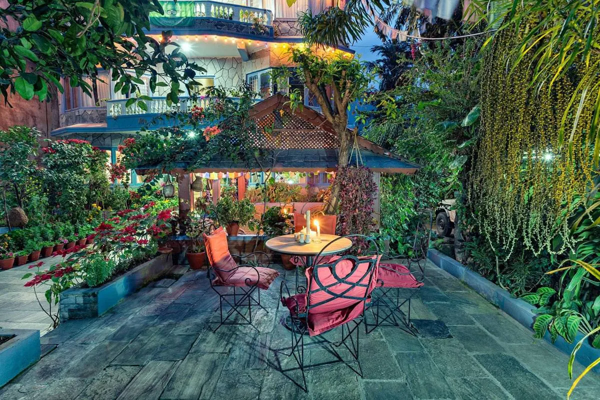 Garden courtyard at dusk at The Silver Oaks Inn, Pokhara