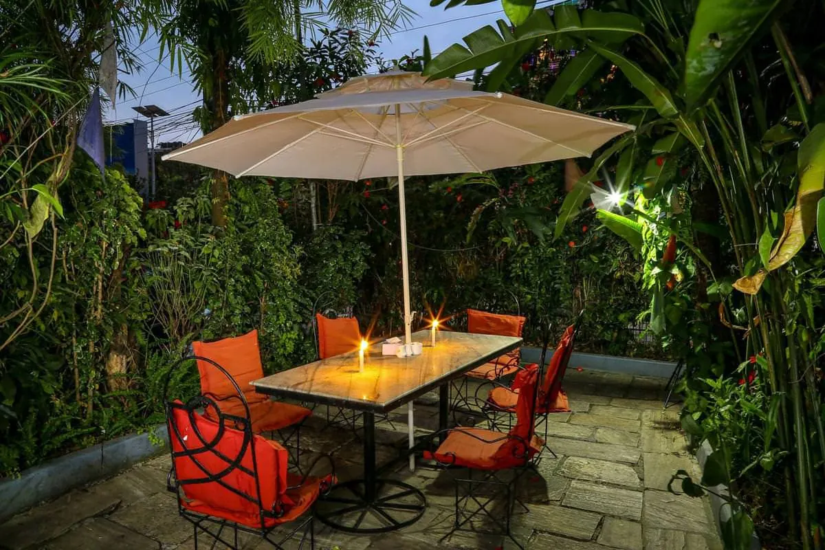 Candlelit garden table at The Silver Oaks Inn, Pokhara
