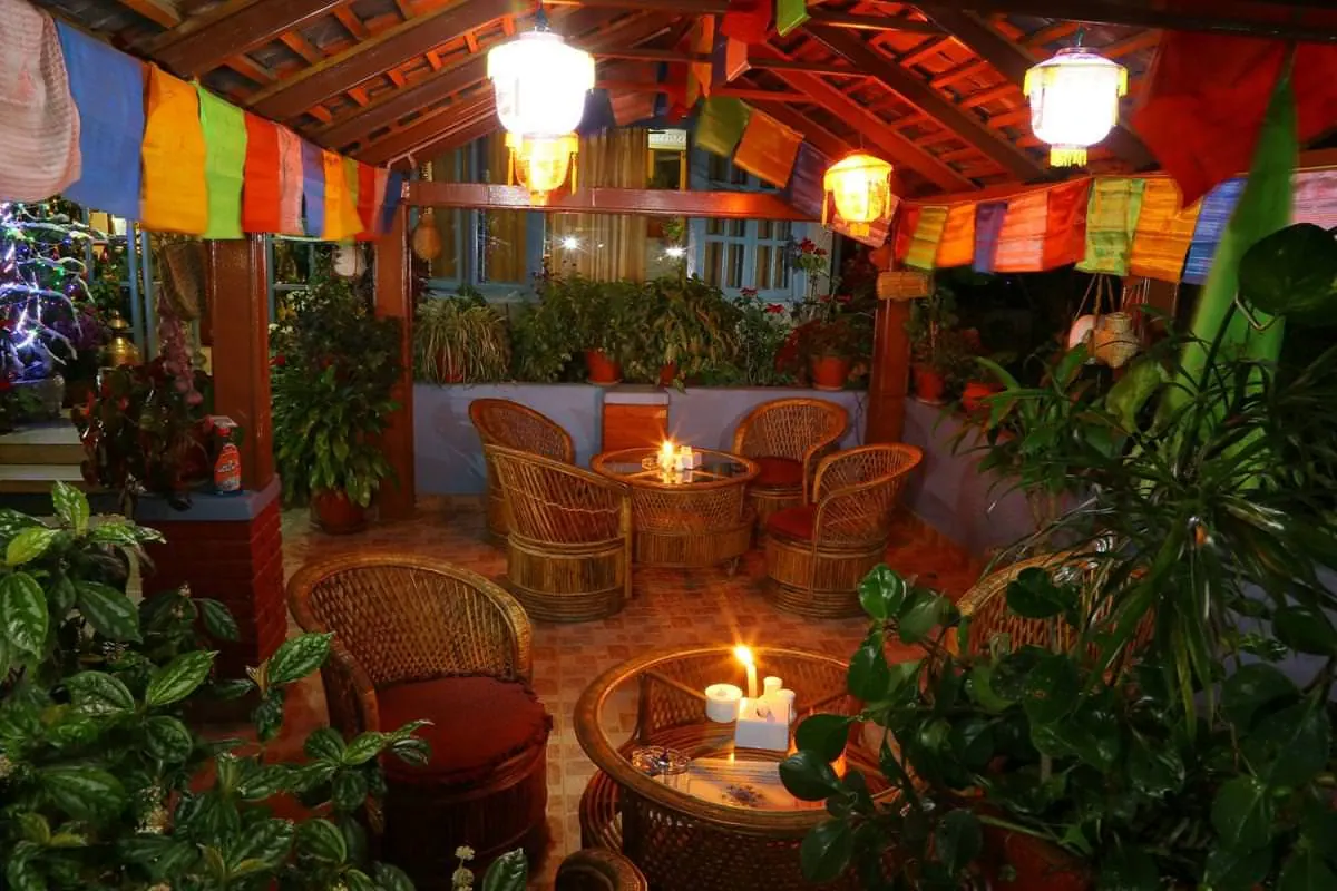 Lantern-lit garden seating at The Silver Oaks Inn, Pokhara