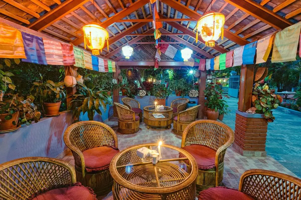 Garden pavilion with cane chairs at The Silver Oaks Inn, Pokhara