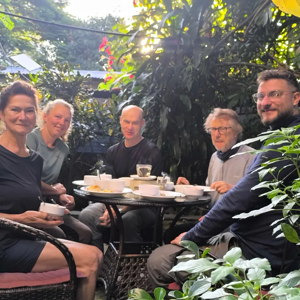 Guests having coffee together in the garden