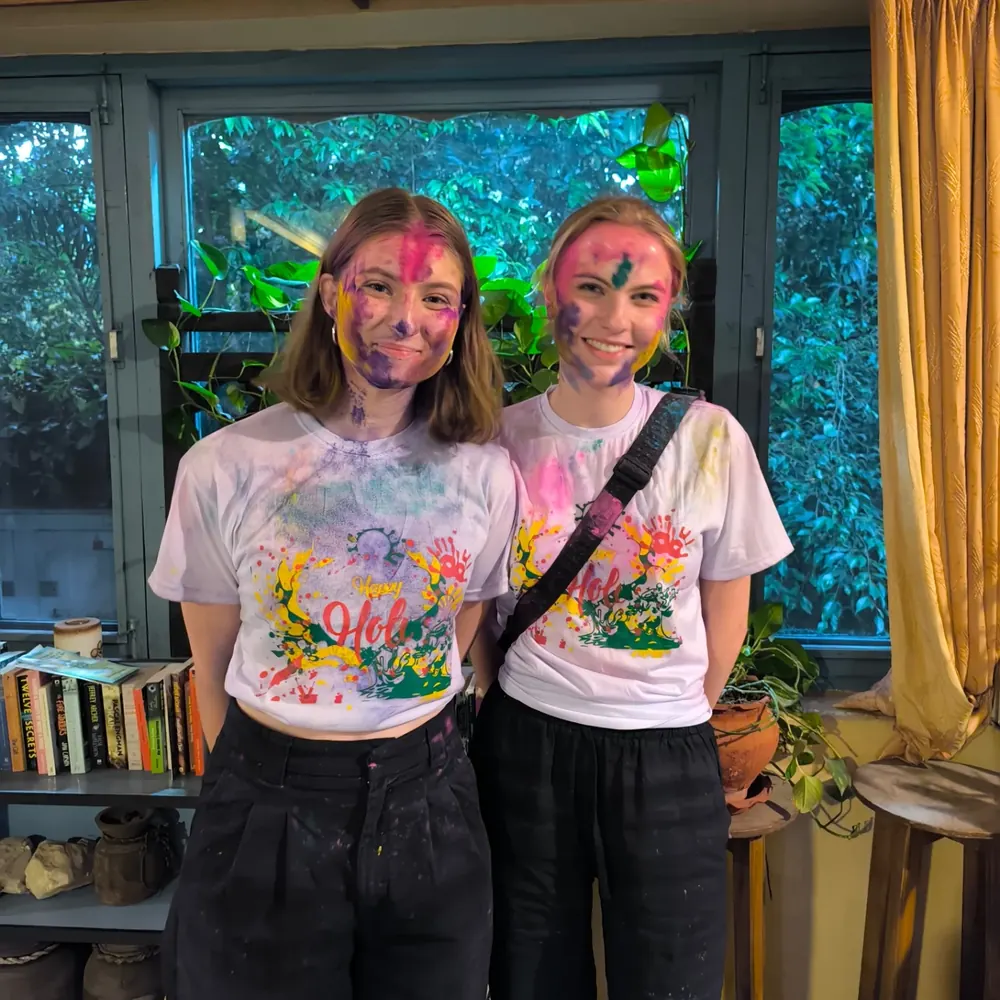 Two friends celebrating Holi