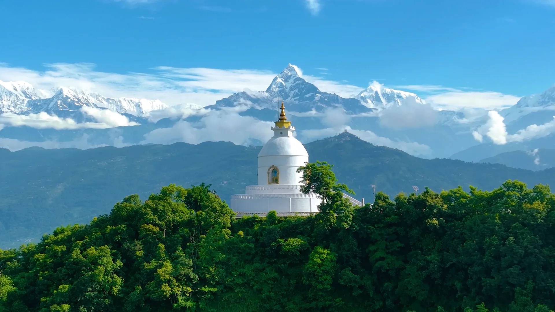 The Peace Pagoda with Machhapuchhre and the Annapurna range behind