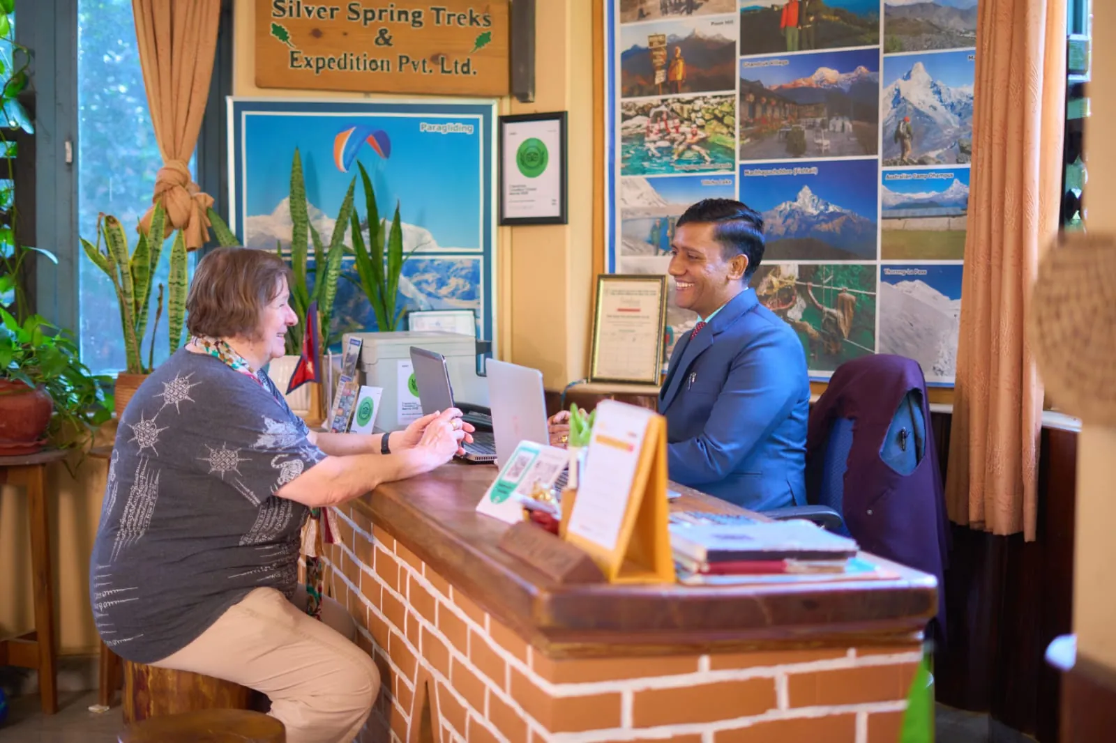 A guest planning a trek with the travel desk