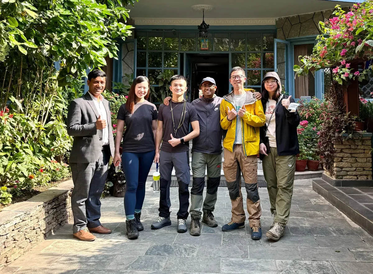 Trekking group with the hotel team in the courtyard
